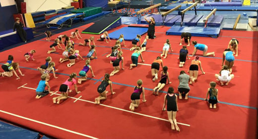 Coach Penny warming up a clinic