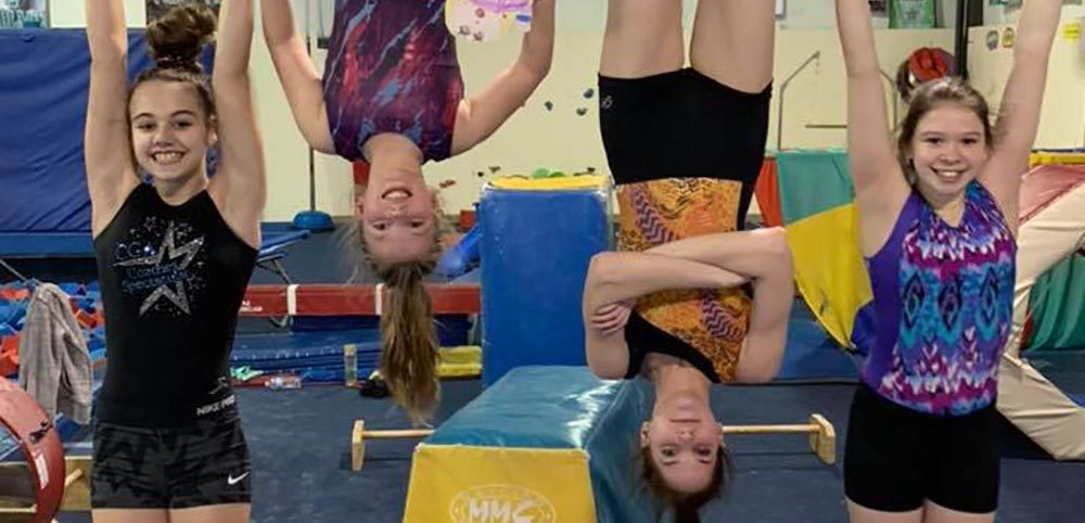 Gymnasts hanging upside down