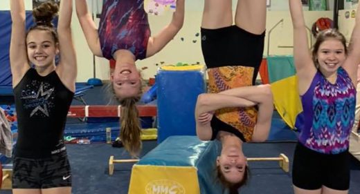 Gymnasts hanging upside down